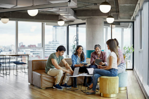 istock Colleagues discussing during meeting in office 1173150763
