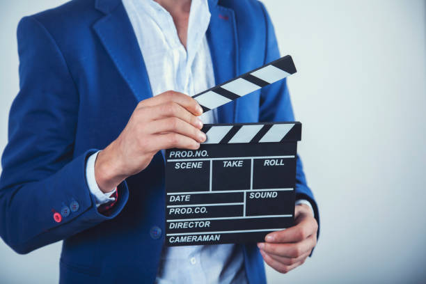 istock man hand movie sign 1173153367