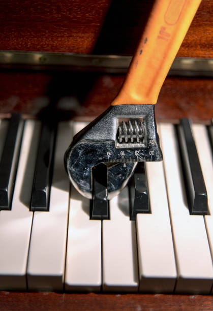 istock An adjustable wrench fixing the keys of a classical piano. 1173154193