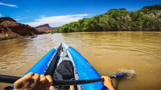 istock POV  rafting with kayak in Colorado river, Moab 1173154507