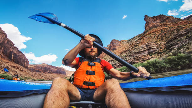 istock POV  rafting with kayak in Colorado river, Moab 1173154541