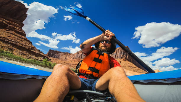 istock POV  rafting with kayak in Colorado river, Moab 1173154570