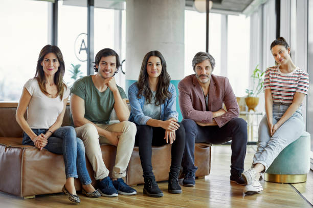 istock Confident coworkers sitting in creative office 1173155753