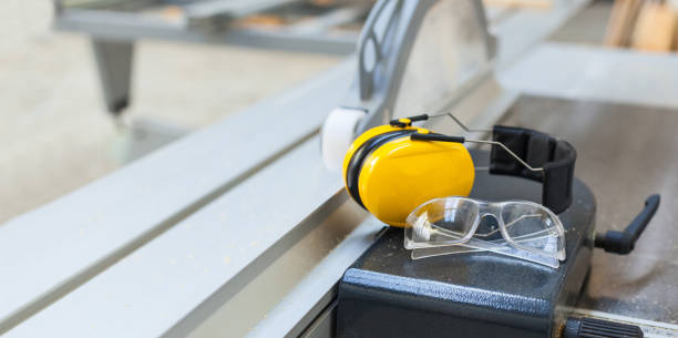 istock Occupational safety Protective glasses and hearing protection on circular saw in the workshop 1173157643