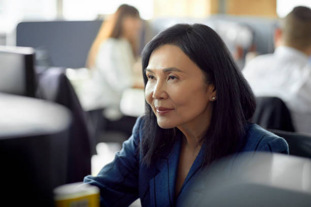 istock Confident businesswoman working at desk in office 1173159496