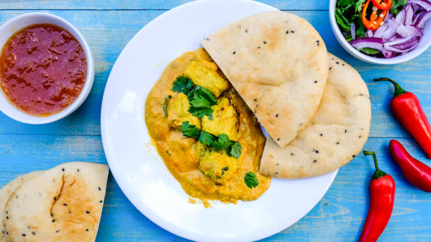 istock Indian Chicken Korma Curry Meal With Naan Bread 1173160080
