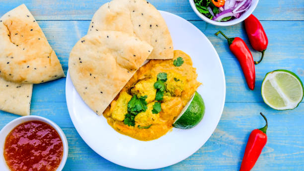 istock Indian Chicken Korma Curry Meal With Naan Bread 1173160085