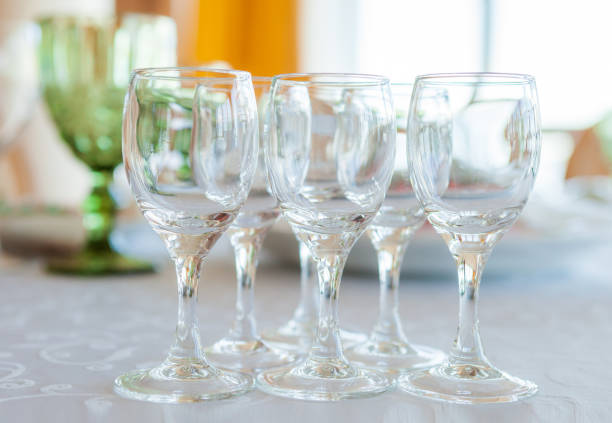 istock Glasses on a laid served wedding table, close-up 1173160770