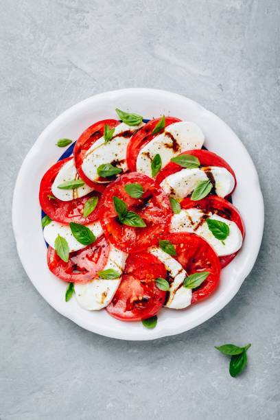 istock Tomato, basil, mozzarella Caprese salad with balsamic vinegar and olive oil. 1173160819