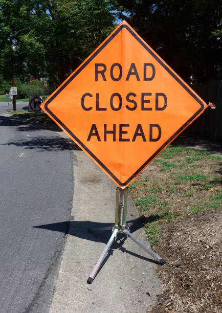 istock ROAD CLOSED AHEAD Sign 1173162456