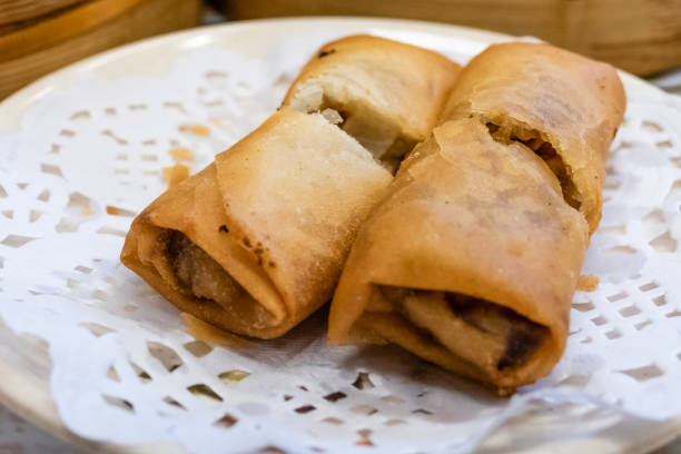 istock Spring rolls in a plate in front of bamboo steamers 1173162697