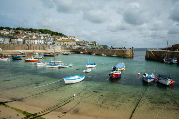 istock Mousehole Harbour UK, Cornwall Port, summer vacation town 1173163050