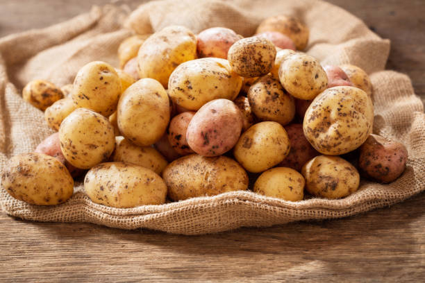 istock fresh potatoes on wooden table 1173164671