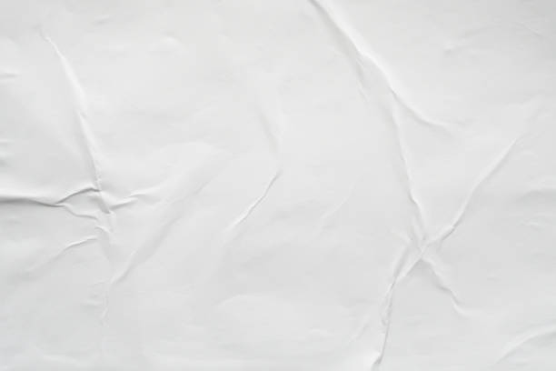 istock Blank white crumpled and creased paper poster texture background 1173165925