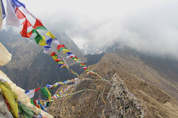 istock prayer flags fluttering on a rope over the canyon in Nepal 1173167708