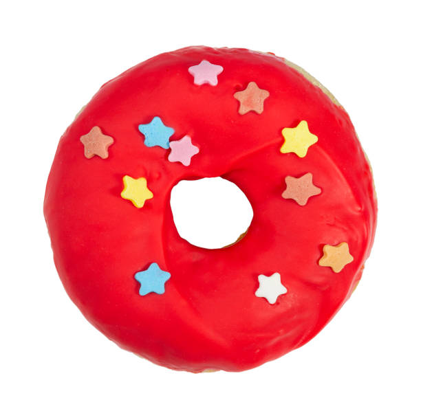 Donut with red icing and sprinkles isolated on white
