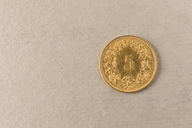 istock Gold coin on grey background. Close up. 1173169769