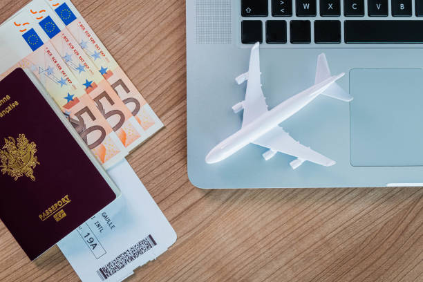 istock Holiday economy calculation passport computer euro dollar 1173170508
