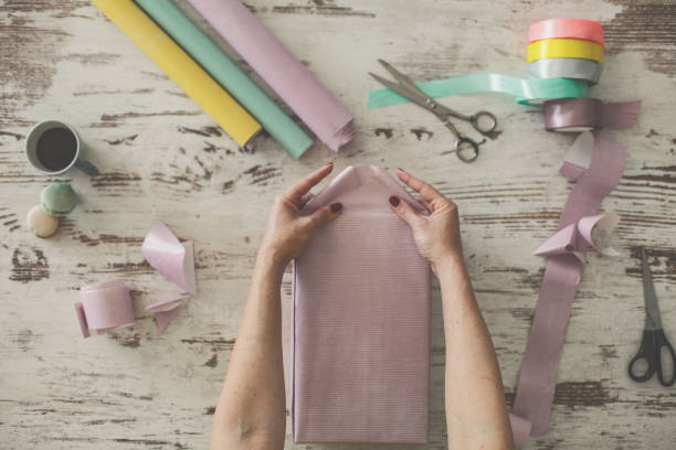 istock Enjoying wrapping gifts 1173173814