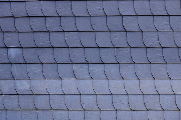 Aged slate roof tiles in close-up