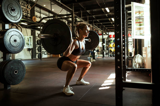 istock Young fit woman lifting weights 1173174056