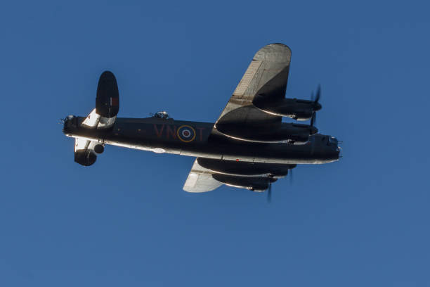 Dronten, Netherlands may 4 2018: World war 2 Avro Lancaster making a fly-by Setting sun reflecting on a Lancaster making a fly-by. This photo has been taken during the memorial of the fallen soldiers of world war two. lancaster texas stock pictures, royalty-free photos & images