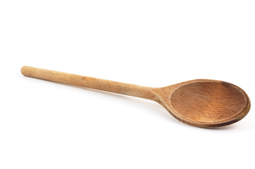 A wooden cooking spoon isolated on white