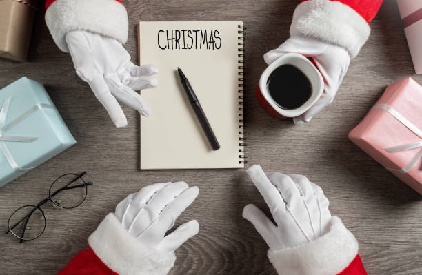 istock Santa clauses are planning and talking. 1173184451