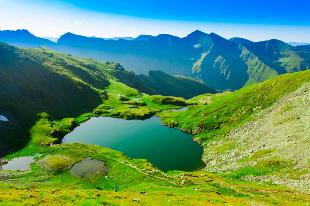 istock lake Capra in Fagaras mountains, Romania 1173185465