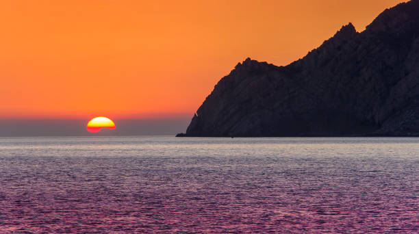 istock sunset on the sea, Italy coast 1173185543
