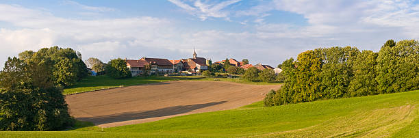 istock Swiss Village Panorama with fields in evening 117318632