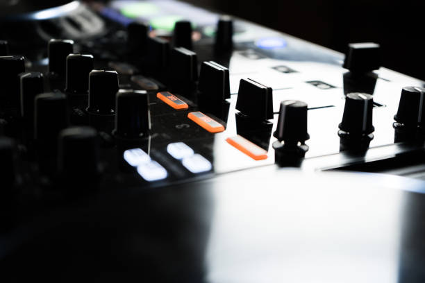 istock Wide angle photo of black sound mixer controller with knobs and sliders 1173187383