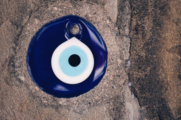 istock glass turkish eye on stone background 1173187606