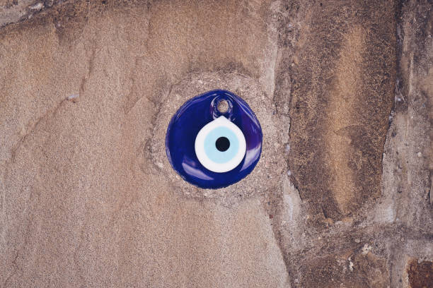 istock glass turkish eye on stone background 1173187677