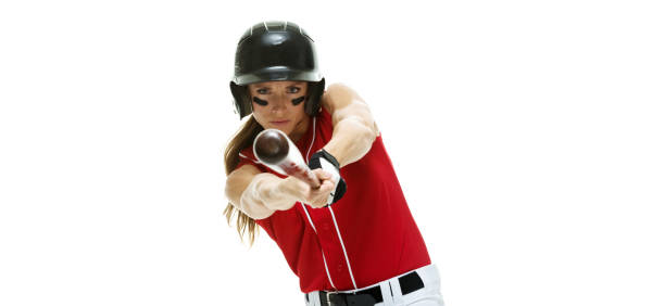 waist up / side view / profile view / looking at camera of 20-29 years old adult beautiful brown hair / long hair caucasian female / young women athlete / baseball player / softball player standing in a sports league in front of white background - 20 25 years profile female young adult imagens e fotografias de stock