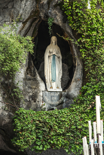Statue Of Our Lady Of Immaculate Conception With A Rosary In The Grotto ...