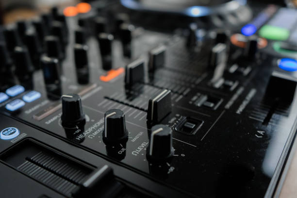 istock Wide angle photo of black sound mixer controller with knobs and sliders 1173189988