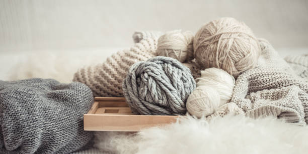 istock cozy background Wallpaper with the yarn for knitting. 1173190447