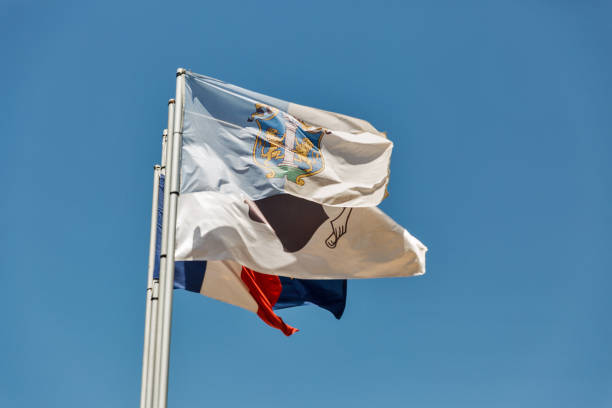 Flags of Ajaccio, Corsica, France and EU Waving flags of Ajaccio, Corsica, France and European Union against clear blue sky corsican flag stock pictures, royalty-free photos & images