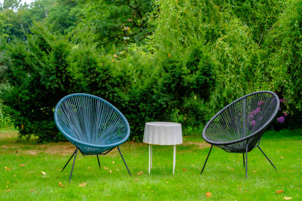 istock Two outdoor chairs stand on the grass 1173197774