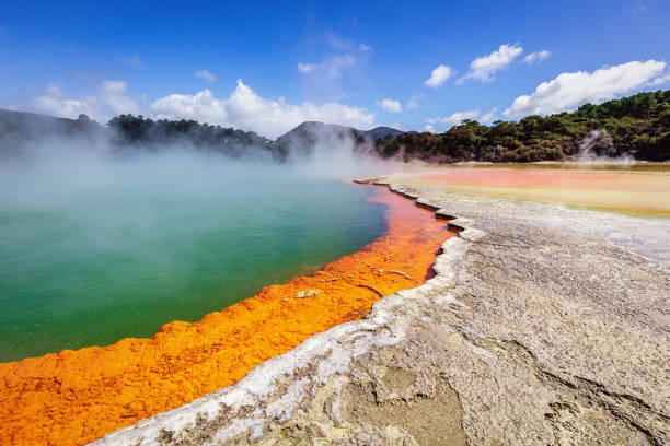 Waiotapu New Zealand Geothermal Champagne Pool Colorful orange - green Champagne Pool in the Waiotapu Thermal Wonderland. The pool is a 65 m wide spring, containing multiple minerals that are presently depositing in the surrounding sinter ledge. Waiotapu, North Island, New Zealand. rotorua stock pictures, royalty-free photos & images
