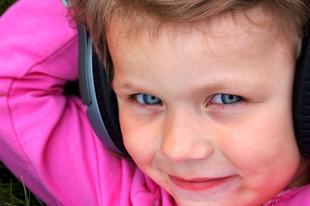 Young girl listening to music stock photo