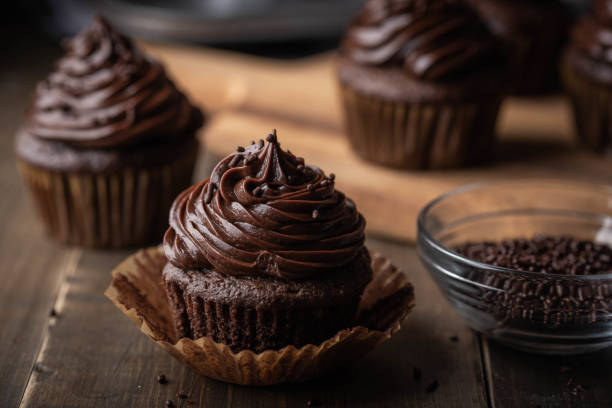 istock chocolate cupcake on dark wooden background 1173204686