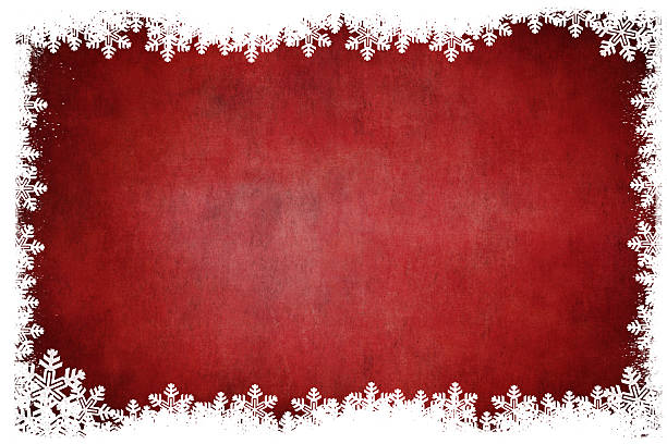istock White snowflakes border on grungey red background 117320611