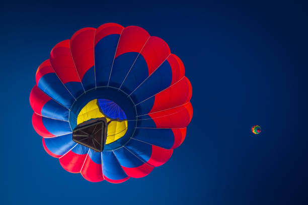 istock Hot air balloons in clear sky 1173206632