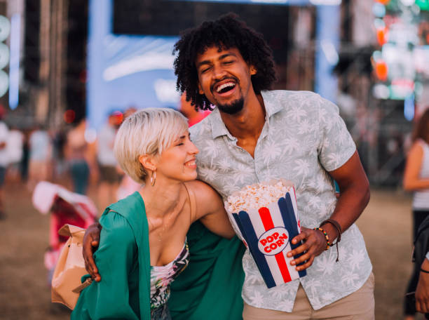 istock Couple laughing and having popcorn 1173211311