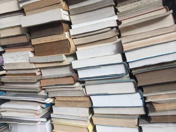 istock Stacks of old books at a second hand book store 1173211837