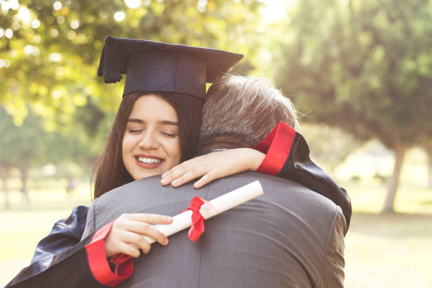istock Graduation Day Father Proud Hugging Concept 1173214763
