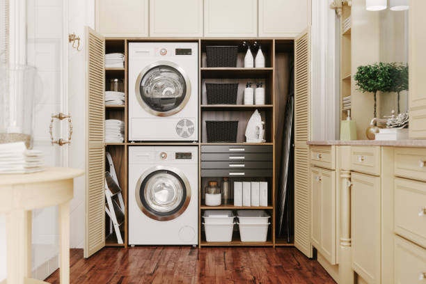 Interior Of A Modern Laundry Room Washing machine and dryer in a luxury bathroom. washing machine photos stock pictures, royalty-free photos & images