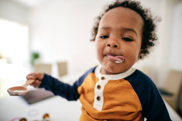 istock Toddler eating yogurt 1173222605